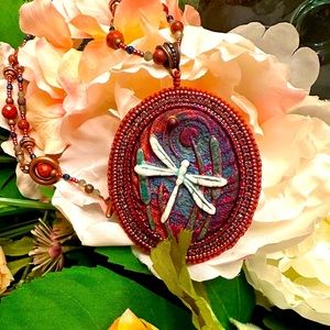 Bead embroidered clay pendant with beaded rope